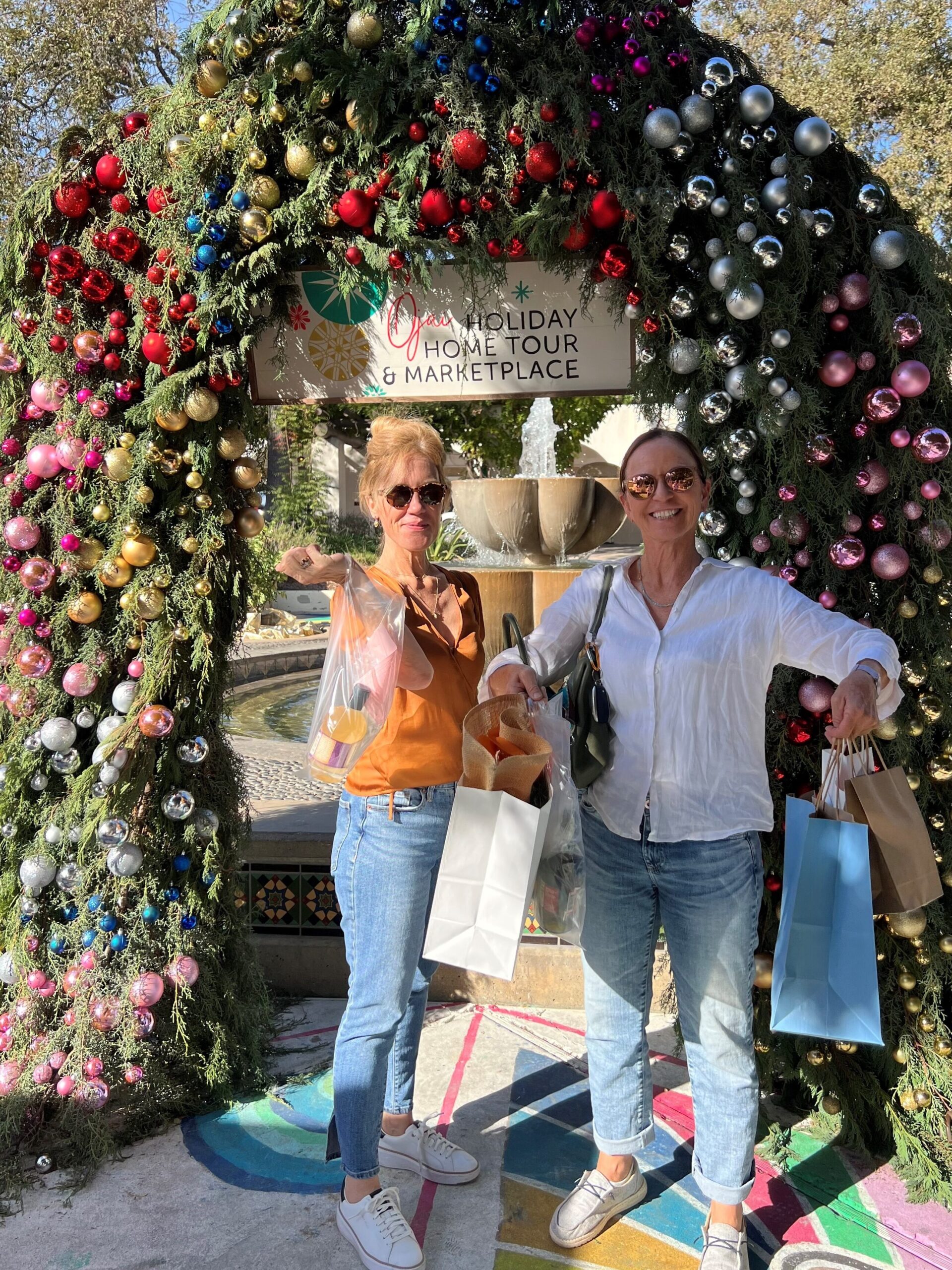 Shoppers pose under decorative archway